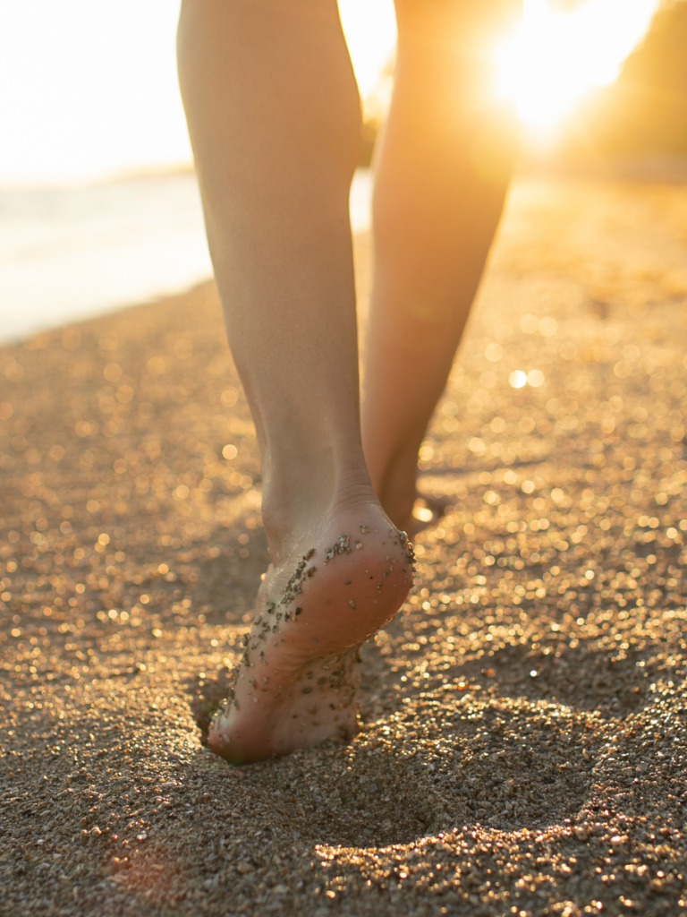 woman walking on the beach the sovereign woman miroslava casiano
